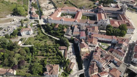 UNESCO-world-heritage-site,-monastery-of-Alcobaça-at-central-Portugal,-aerial-pan-view