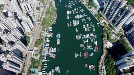 Aberdeen-harbour-and-skyline-in-southwest-Hong-Kong-island-on-a-beautiful-day,-Aerial-view