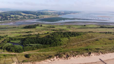 Aerial-Over-Dawlish-Golf-Course-Beside-Sand-Pits-And-Mouth-Of-River-Exe