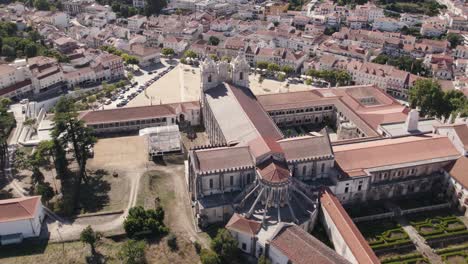 Aerial-pan-shot-capturing-the-cistercian-architecture-historic-landmark-of-Mosteiro-de-Alcobaça