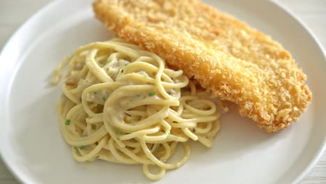 homemade-spaghetti-pasta-white-cream-sauce-with-fried-fish