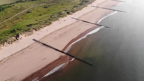Aerial-View-Of-Empty-Dawlish-Warren-Beach-Groyne
