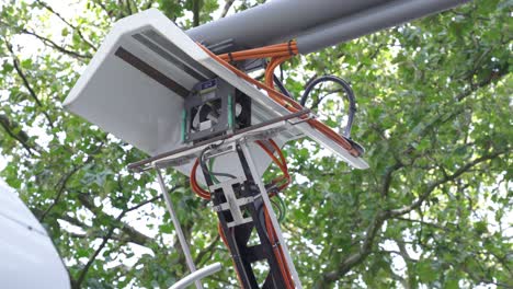 Close-up-of-pantograph-charging-the-electric-bus