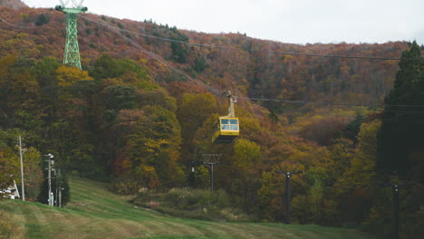 Cable-Car-For-Tourists-Going-Up-In-The-Mount-Zao-With-Autumnal-Forest-In-The-Background