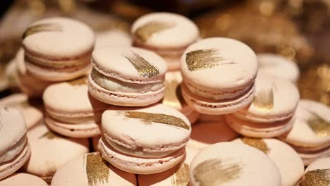 Close-Up,-Large-Stack-of-Delicious-Macarons-With-Golden-Streaks-At-Wedding-Party