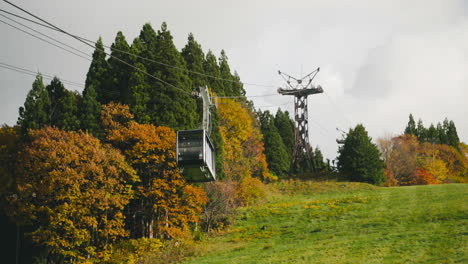 Cable-Car-Ascending-On-Mountain-Hill-Carrying-Tourists-Going-In-Zao-Mountains-During-Autumn-Season-In-Japan
