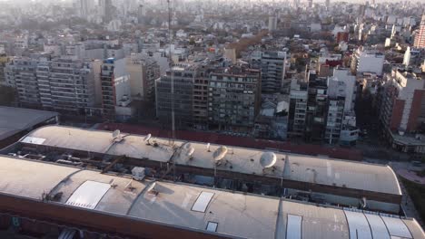 Aerial-view-of-city-buildings-in-residential-area-and-a-large-TV-studio-in-Buenos-Aires,-Argentina