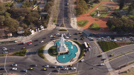 Aerial-flyover-Monument-to-the-Carta-Magna-and-Four-Regions-of-Argentina-with-traffic-on-road-in-Buenos-Aires