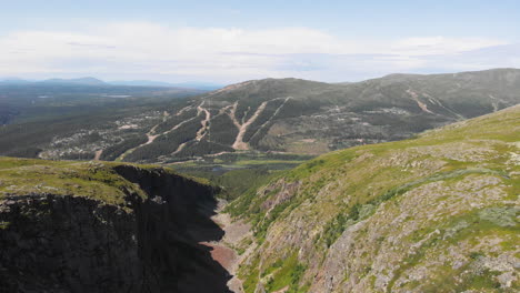Incredible-aerial-shot-flying-over-a-mountain-valley-and-canyon-in-Sweden