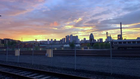 Abandon-railway-yard-with-Montrail-skyline-and-a-golden-sunset-fading-in-the-background