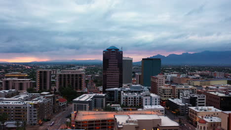 High-rise-Buildings-In-Downtown-Tucson-In-Arizona-With-Santa-Catalina-Mountains-In-Distant-Background-At-Sunset