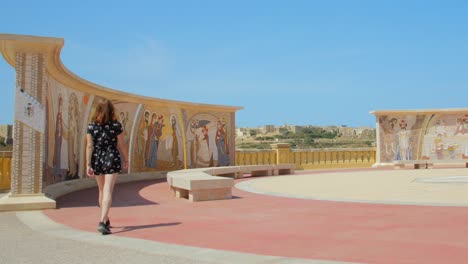 Female-Tourist-Walking-Towards-Frescos,-Mural-Painting-In-Basilica-of-the-National-Shrine-of-the-Blessed-Virgin-of-Ta'-Pinu-In-Gharb,-Malta
