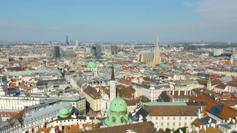 Drone-Flies-Above-Historic-District-toward-Iconic-St-Stephen's-Cathedral,-Vienna