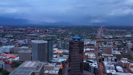 View-From-Above-Of-Buildings-And-Traffic-In-Downtown-Tucson,-Arizona-At-Dusk-With-Overcast
