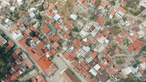 Small-Old-Houses-Of-Mayan-Community-In-Palopo-Guatemala---aerial-shot