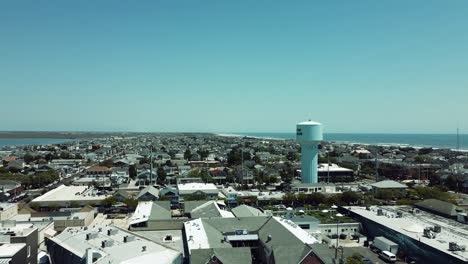 Drone-shot-heading-circling-towards-the-Stone-Harbor-water-tower-in-New-Jersey