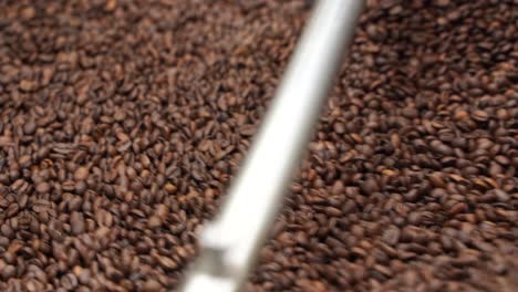 Closeup-Of-Coffee-Beans-During-The-Roasting-Process-In-The-Machine