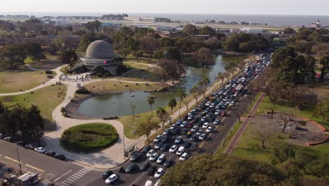 Aerial-view-of-traffic-at-highway-around-Galileo-Galilei-planetarium,-Parque-Tres-de-Febrero,-Buenos-Aires,-Argentina