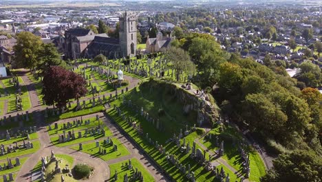 Cinematic-drone-shot-in-Scotland-kirkyard,-castle-and-landscape