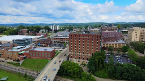 Aerial-drone-footage-of-downtown-Jamestown,-New-York,-during-summer-time-on-a-sunny-day