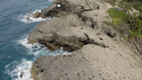 Aerial-View-On-Rocky-Shoreline-And-Ocean-At-Punta-Las-Tunas-And-Cueva-del-Indio-In-Puerto-Rico---drone-shot