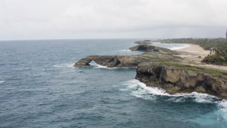 Panoramic-View-On-Seascape-Of-Rocky-Atlantic-Coast-Near-Cueva-del-Indio-In-Northern-Puerto-Rico---aerial-drone-shot
