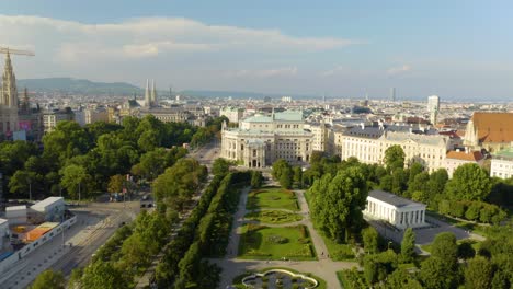 Pullback-Away-from-Vienna's-Rose-Garden-with-Government-Buildings-in-Background
