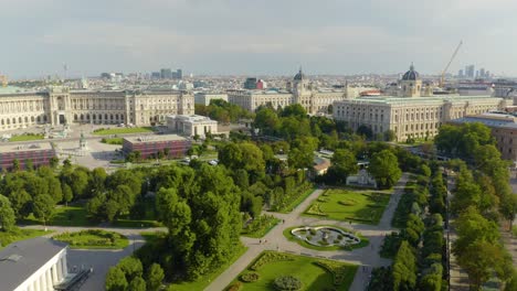 Aerial-Establishing-Shot-of-Volksgarten-and-Rosengarten-Parks-in-Vienna,-Austria-on-Beautiful-Summer-Day