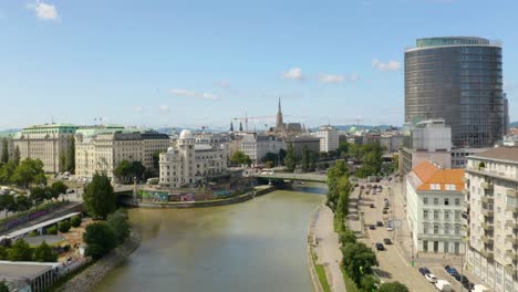 Beautiful-Establishing-Shot-of-Drone-Flying-over-Danube-Canal-in-Vienna,-Austria