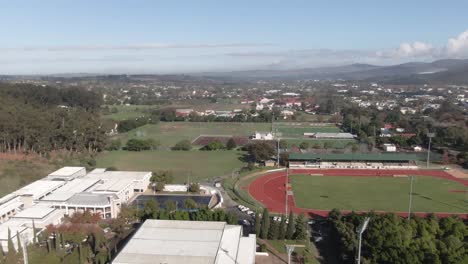 Aerial-View-Of-A-Football-Pitch-Surrounded-By-Oval-Running-Tracks-For-Athletics-In-South-Africa