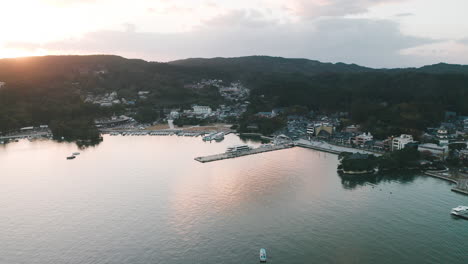 Boats-And-Ferry-Docked-At-The-Marina-And-Pier-In-Matsushima-Bay,-Fukuura-Island,-Miyagi,-Japan-At-Sunset