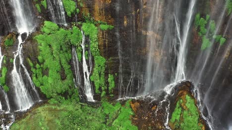 View-from-above,-stunning-aerial-shot-of-the-Tumpak-Sewu-Waterfalls-Coban-Sewu