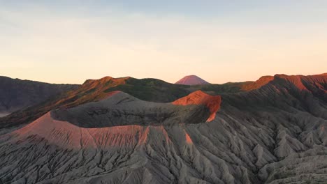 Aerial-shot-of-Mount-Bromo-landscape,-sunny-morning-light,-drone-shot-of-Mount-Bromo-and-Batok-Volcano