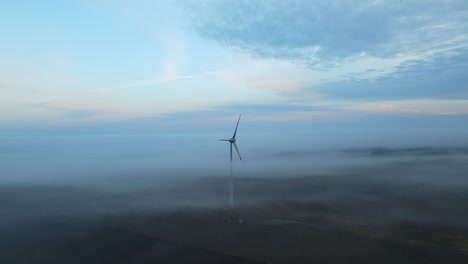 Beautiful-countryside-landscape-with-windmill-during-foggy-day-in-the-morning,4K-aerial-view