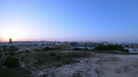 Malta,-turning-timelapse-video-from-Manoel-Island,-showing-Sliema,-Ta'-Xbiex-and-Valletta-cities-during-sunset