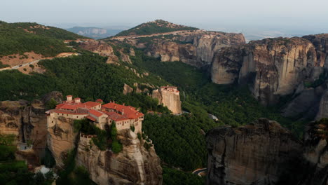Varlaam-Monastery-With-Monastery-Of-Rousanou-At-Background-Surrounded-By-Rugged-Cliffs-In-Meteora-Complex,-Greece