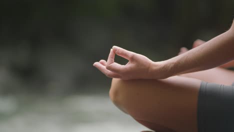 Gyan-Mudra,-index-finger-and-thumb-of-woman-touching-during-yoga-meditation