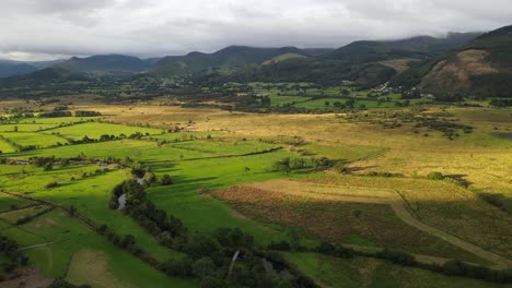 Valley-in-Lake-District-Braithwaite-sunrise-clouds-over-surrounding-Hills-drone-footage