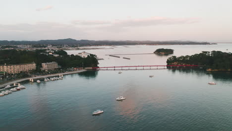 Aerial-View-Of-Red-Fukuurabashi-Bridge-Across-Matsushima-Bay-In-Fukuura-Island,-Miyagi,-Japan-At-Dusk