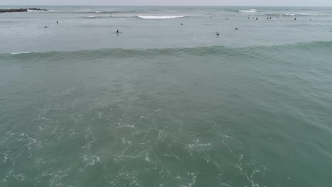 Aerial-shot-of-Surfers-in-Lima-during-the-winter