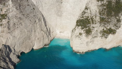 Beautiful-Beach-Walled-By-White-Rugged-Cliffs-In-The-Ionian-Sea,-Island-Of-Zakynthos-In-Greece