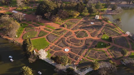 Aerial-shot-of-beautiful-Palermo-Rosedal-Garden-Park-beside-Lake-in-Buenos-Aires