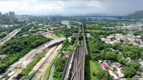 Hong-Kong-MTR-Railroad-in-the-city-outskirts,-Aerial-view
