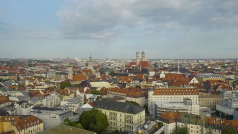 Ascending-Aerial-Shot-Reveals-Munich's-Marienplatz-on-Beautiful-Summer-Day