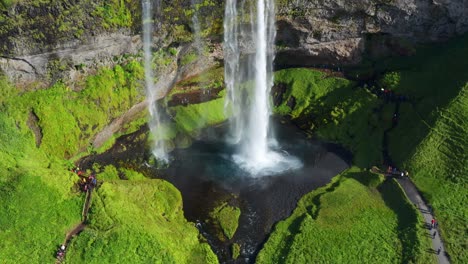 Glacier-Meltwater-Flowing-In-Seljalandsfoss-Cascade-Into-Seljalands-River-with-Green-Nature-IN-South-Iceland