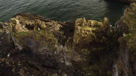 Beautiful-Rock-Formations-on-Ocean-Coast-of-West-Iceland---Aerial-Orbit
