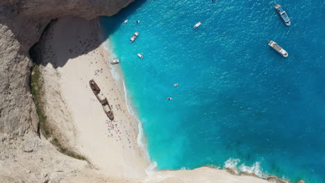 Beautiful-bright-hidden-Shipwreck-beach-in-Zakynthos,-Greece--Aerial