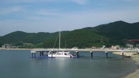 Charter-Catamaran-Yacht-At-Jetty-Near-Hanwha-Resort-Geoje-Belvedere,-Geoje-Island,-South-Korea