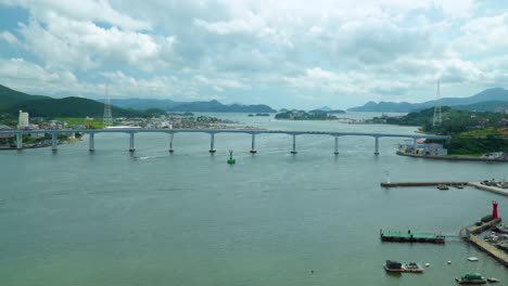 Geoje-Bridge-Over-Calm-Sea-With-White-Clouds-In-The-Sky-In-South-Korea