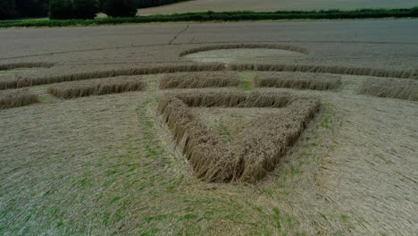 Swarraton-golden-barley-field-strange-closeup-crop-circle-aerial-view-orbit-low-forward-flying-above-Hampshire-farmland
